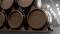 Barrels of wine, whiskey, bourbon liqueur or cognac in the basement. Aging of alcohol in oak barrels in warehouse. Wine Royalty Free Stock Photo