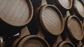 Barrels of wine, whiskey, bourbon liqueur or cognac in the basement. Aging of alcohol in oak barrels in warehouse. Wine Royalty Free Stock Photo
