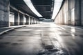 A barren concrete road leads to an underground parking garage. focus on the ground with care.