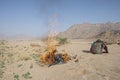 Barren desert landscape in hot climate with campfire Royalty Free Stock Photo