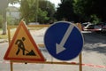 Barricade with traffic signs on city street. Road repair Royalty Free Stock Photo