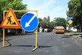 Barricade with traffic signs on city street. Road repair Royalty Free Stock Photo