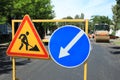Barricade with traffic signs on city street. Road repair Royalty Free Stock Photo