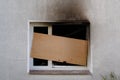 Barricaded window after the fire damage in an apartment house, concept for arson, negligence and insurance Royalty Free Stock Photo