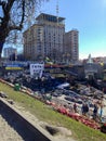 Barricades of tires and garbage, a bridge with posters, flags and slogans, many laid flowers on the Maidan