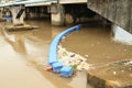 Barrier catching trash on river in Manado