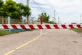 The barrier close the road. loses the passage for cars. Traffic forbidden road sign on a main road.Protected area, entrance is pro Royalty Free Stock Photo