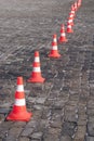 Barrier color cones on the stone pavement Royalty Free Stock Photo