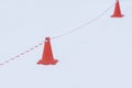 Barrier cones and tape. Winter roadblock. Danger, traffic cone.