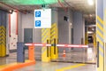 Barrier at the entrance to the underground parking sign under the apartment building