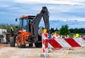 Barrier at a road construction site. The construction site is protected by warning signs Royalty Free Stock Photo