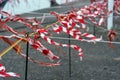 Barrier tape of plastic with red and white stripes luttering in Royalty Free Stock Photo