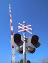 Barrier and traffic light at a railway crossing in Haifa in Israel close-up. Royalty Free Stock Photo