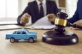 Barrister and car model on notary table