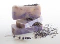 Bars of lavender soap with dried buds scattered around Royalty Free Stock Photo