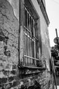 Bars in the old window. Black and white photo of old brick building. Jail. Royalty Free Stock Photo