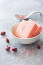 Bars of rose soap and dry rose flowers