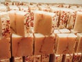 Bars of soap on a shop window. Fruit soap with natural cedar oil and herbal ingredients. Handmade natural cold process soap. Eco-