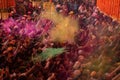 Crowds can be seen below duirng Holi Festival in India, throwing Royalty Free Stock Photo