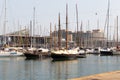 BARSELONA, SPAIN - AUGUST 6, 2019: Yachts parked in the port of Barcelona at summer noon.