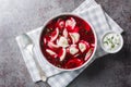 Barszcz z uszkami beetroot soup, borsch with small dumplings closeup on the plate. Horizontal top view Royalty Free Stock Photo