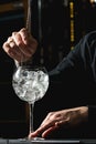 Bartender cooling out Cocktail glass