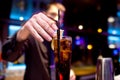 The bartender decorates slice of lemon glass of fizzy drink