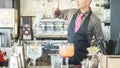 Bartender doing flair inside american bar - Barman at work performing freestyle - Focus on man face and bottle - Bartending, Royalty Free Stock Photo