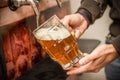 Bartender filling up with a blonde craft beer into a pint glass Royalty Free Stock Photo