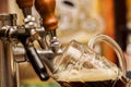 Bartender filling up a dark with craft beer a pint glass Royalty Free Stock Photo