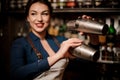 Bartender girl holding two steel cocktail shakers Royalty Free Stock Photo