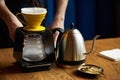 Barista pouring water on coffee ground with paper filter Royalty Free Stock Photo