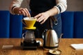 Barista pouring water on coffee ground with paper filter Royalty Free Stock Photo