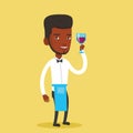 Bartender holding a glass of wine in hand.