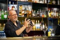 Male bartender makes a cocktail