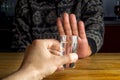 Man`s hand rejecting a glass of alcoholic beverage. Concept Royalty Free Stock Photo