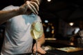 Bartender makes an alcoholic carbonated sweet cocktail at the bar. Alcoholic drinks at the bar or the nightclub. Night life Royalty Free Stock Photo