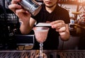 Bartender is making cocktail at bar counter. Fresh cocktails. Barman at work. Restaurant. Nightlife. Royalty Free Stock Photo