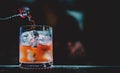 Bartender making Cuba Libre cocktail pouring cola in glass Royalty Free Stock Photo