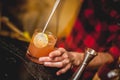 Bartender making and decorating cocktail close-up Royalty Free Stock Photo