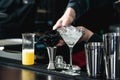 Bartender making relaxing cocktail on a bar background Royalty Free Stock Photo