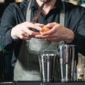 Bartender making relaxing coctail on a bar background Royalty Free Stock Photo