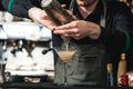 Bartender making relaxing coctail on a bar background Royalty Free Stock Photo