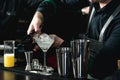 Bartender making relaxing coctail on a bar background Royalty Free Stock Photo