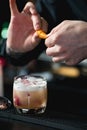 Bartender making relaxing coctail on a bar background Royalty Free Stock Photo