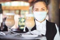 Bartender in medical mask and gloves makes latte coffee