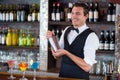 Bartender mixing a cocktail drink in cocktail shaker Royalty Free Stock Photo