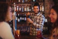 Bartender mixing a cocktail drink in cocktail shaker Royalty Free Stock Photo