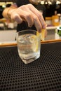 Bartender mixing cocktails for customers on bar counter Royalty Free Stock Photo