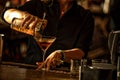 Bartender Mixing Drinks at a Bar Royalty Free Stock Photo